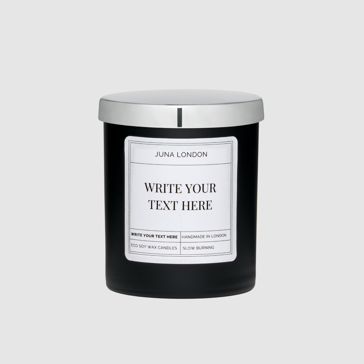Black candle with a customizable label and a silver lid on a light gray background