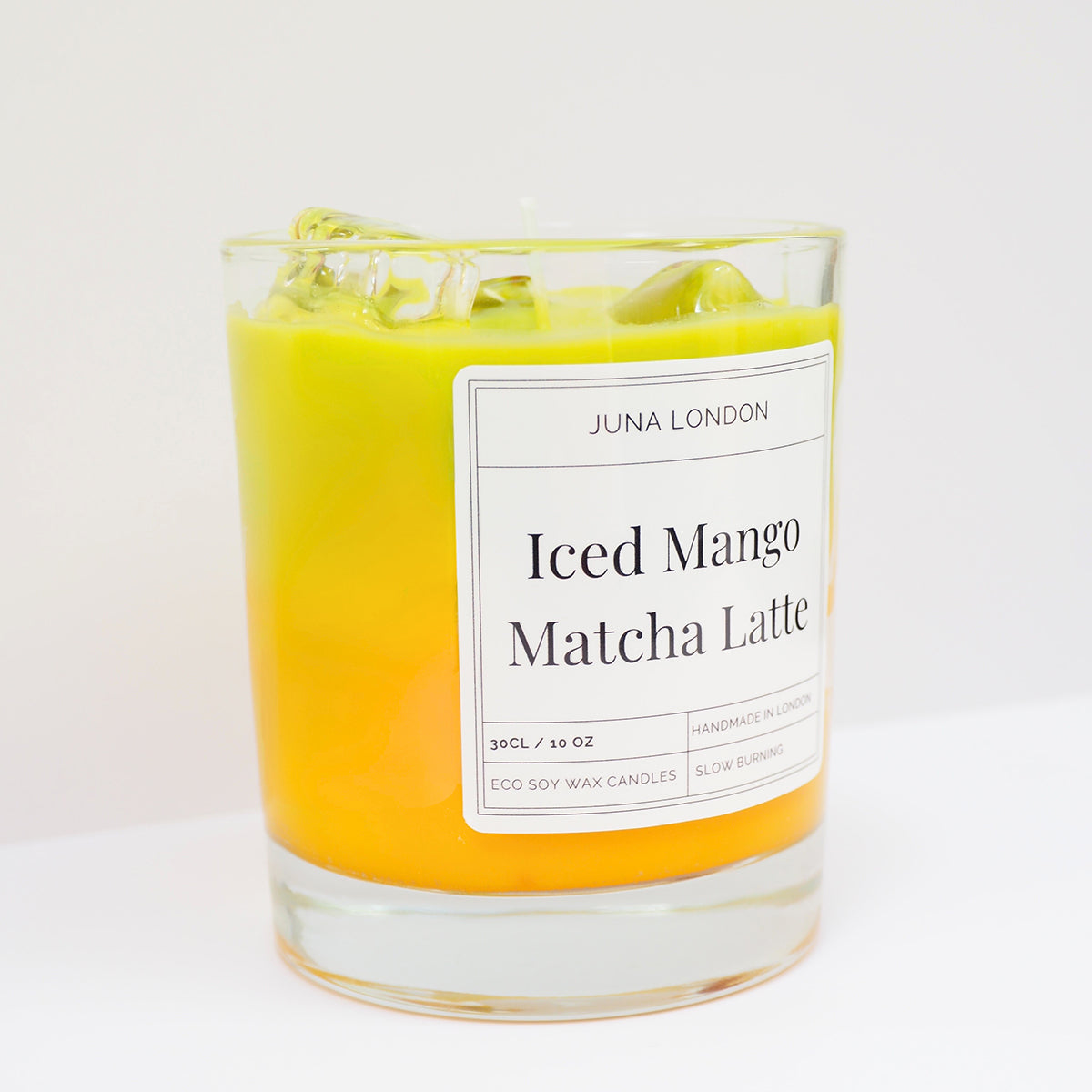 JUNA London The Iced Mango Matcha Latte Candle. Handmade with soy wax and  gel wax, scented with matcha and mango fragrance and essential oils. Ideal for gifting to matcha lovers.