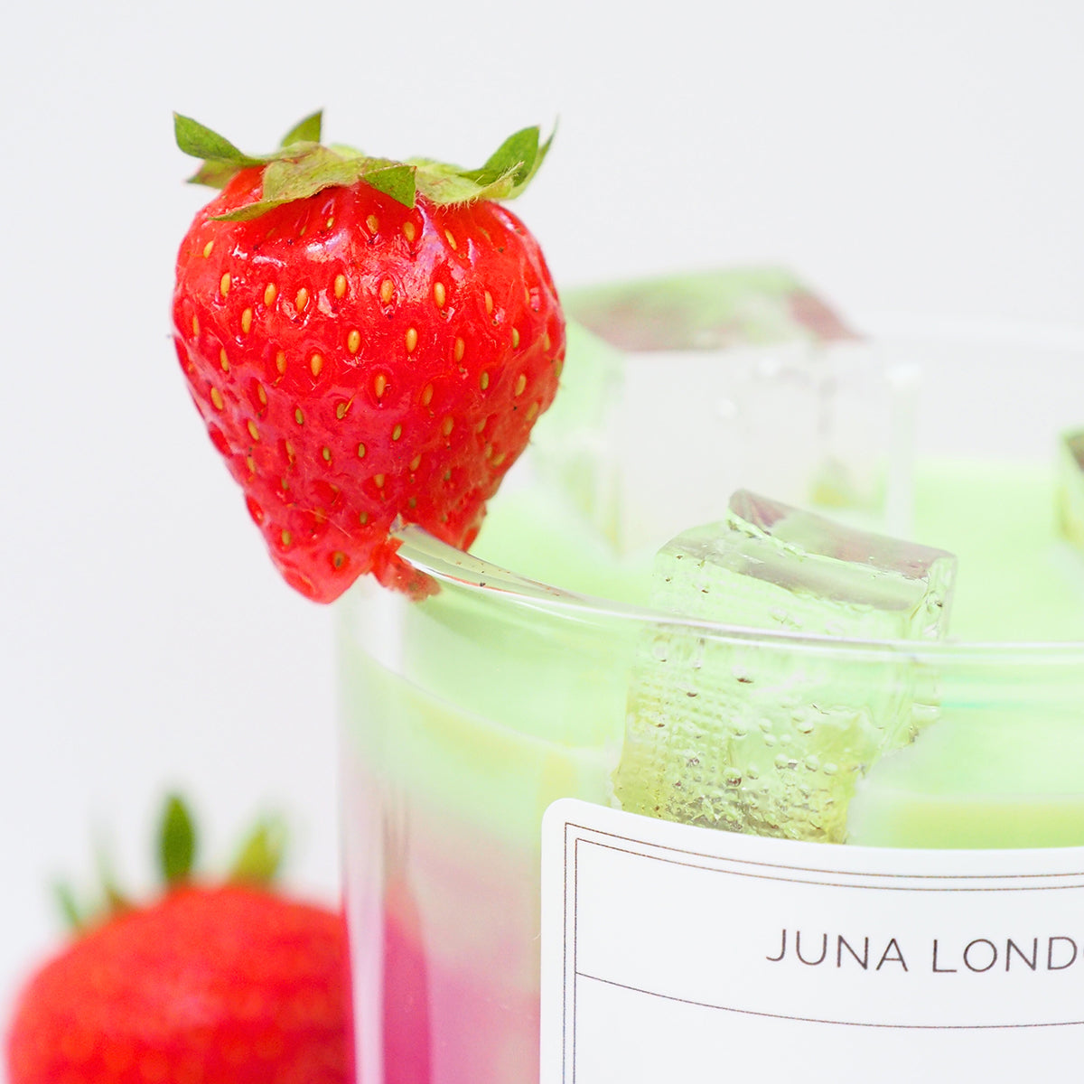 A decorative, vibrant candle to adorn any shelf, dresser or bedside table. Handcrafted from a combination of gel and soy wax, known for their clean and long-lasting burn time. Jelly-like ice cubes are a tactile, hyper-realistic touch making our Iced Strawberry Matcha Latte Candle one of a kind - the perfect gift idea for the matcha-obsessed. 