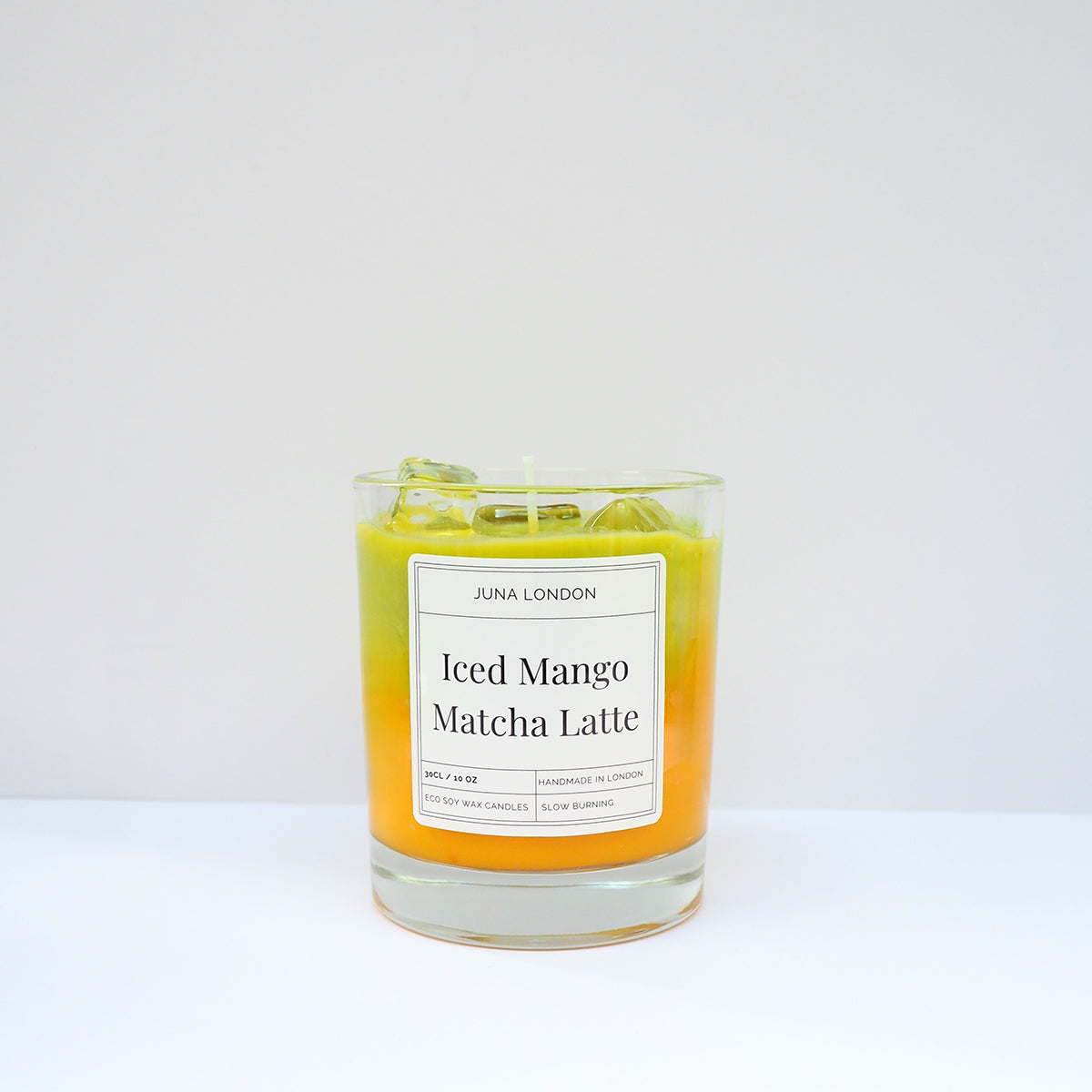 JUNA London The Iced Mango Matcha Latte Candle. Handmade with soy wax and  gel wax, scented with matcha and mango fragrance and essential oils. Ideal for gifting to matcha lovers.